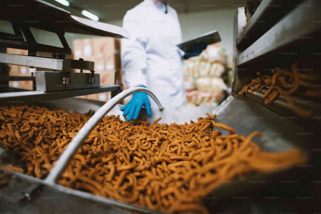 close up of salty snacks in factory production line
